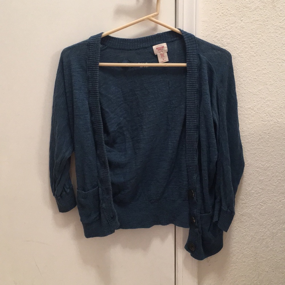 Blue cardigan with brown buttons